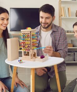 Alternative view of Joc montessori de societate, Joc de echilibru cu bețe și bile, 3 ani